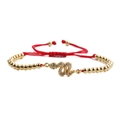 Detail of red cord snake bracelet with gold beads and green zircon snake charm - Red Rope Gold Bead Snake 3