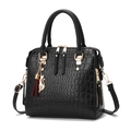 Black crocodile texture handbag with gold hardware and a cat tassel charm - Black