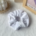 Minimalist white velvet scrunchie with soft pleated texture and elegant aesthetic - White