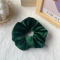 Deep dark green velvet scrunchie shown with elegant props in lifestyle photography - Army Green