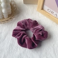 Elegant deep purple velvet hair scrunchie with soft gathered folds and a premium silky texture - Grape Purple