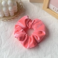 Pink velvet scrunchie hair tie with soft golden sheen texture on white background - Hot Pink