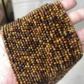 Faceted natural tiger eye gemstone beads with cat eye effect in bulk strand display - Grade A Tiger Eye 3mm