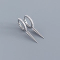 Close-up of S925 sterling silver earrings with micro-set zircon and sleek spike pendants - 925 Silver / White Gold (Pair)
