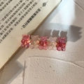Detail of laser-effect resin bears with glitter on a golden metal duckbill hair clip - Rose Pink + Jelly Milk