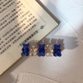 Detail of cute bear hair clip with glitter resin bears on a golden metal base - Dark Blue + Jelly Milk
