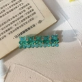 Green translucent gummy bear hair clip with gold metal base on a white surface - Light Blue