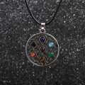 Macro view of Flower of Life pendant with seven colorful gemstones on black cord - Flower of Life - Wax Cord