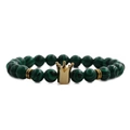 Detailed shot of malachite green beads and gold crown charm on a men's beaded bracelet - Malachite Gold Crown