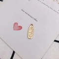 Gold oval lucky charm pendant with engraved horseshoe and clover on wedding invite - Oval Multi-Pattern Lucky Pendant / 10# Gold Lucky Oval Tag