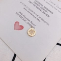 Golden round pendant with embossed starburst and clear zircon on a cream card - 16# Gold Star Round Tag