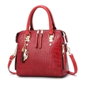 Deep red crocodile pattern PU leather handbag with golden cat charm and tassels - Burgundy