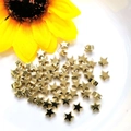 Detailed view of 14K gold plated star-shaped spacers for DIY jewelry making and beading - Star 6mm / 14K Gold Plated