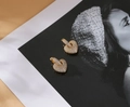 Macro shot of gold heart earrings encrusted with sparkling zircon stones on art print - Gold Plated White Zircon
