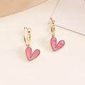 Detail of pink heart-shaped earrings with gold bead edges and lustrous texture - Rose Red