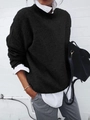 Detail of layered black knit sweater with white collared shirt and casual grey pants - S / Tops / Black