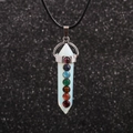 Macro detail of hexagonal white crystal pillar pendant with seven chakra beads on black rope - White Stone Pillar - Wax Cord