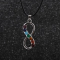 Detail of silver infinity chakra pendant with seven colorful gems on a black cord - Infinity Symbol - Stainless Steel Chain