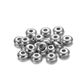 Close-up of polished silver CCB flat round spacer beads with center holes for DIY jewelry - 5mm (400 Pieces/Pack) / White K/Silver