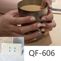 Detail of QF-606 milk pattern nail stickers in cream white with blue droplet designs - QF606
