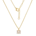 Macro shot of gold letter M pendant with sparkling zircon inlays on a dainty chain - Letter M (XL00063-M)