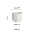 Vaso decorativo in ceramica bianca opaca con rilievo viso minimalista, altezza di 9,5 cm - Barattolo Decorativo Creativo con Rilievo Facciale / Bianco