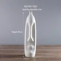 Artistic white ceramic vase with abstract face relief design and matte finish - White Large (WX235)