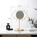 Golden eye-shaped jewelry stand with a round mirror and hooks for earrings and necklaces - Eye Glasses Shape Mirror