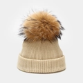 Close-up of beige ribbed knit beanie with a fluffy brown faux fur pom pom detail - Kids 50-53cm(1-5 Years) / Beige