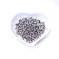 Polished silver metal round spacer beads for jewelry making in a white heart dish - White Gold