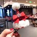 Detail of red glitter Christmas hat hair clip with plush trim and silver snowflake - Christmas Bow