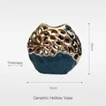 Modern ceramic hollowed vase in gold and peacock blue finish, size 20cm x 18cm x 8cm - Gesang Vase