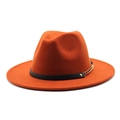 Detail of orange wool fedora featuring a black leather band and gold metal chain link - Rust red