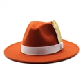 Close-up of orange wool fedora hat with white elastic band and golden feather detail - Adjustable / Rust red