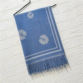 Detail of blue cashmere feel scarf featuring grey daisy floral patterns and fringed edges - Daisy Pattern #9