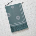 Detail of dark green knit scarf with grey floral jacquard pattern and fringe trim - Daisy Pattern #4