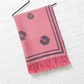 Close-up of pink cashmere-like scarf with grey floral pattern and delicate tassel edge - Daisy Pattern #6