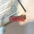 Pink bear hair clip with translucent resin and glitter on an open book, cute style - Rose Pink