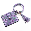 Detail view of purple floral PU leather card holder set with gold ring and tassel - Large Purple Flower