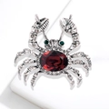 Crab brooch with large oval red gemstone and clear rhinestones on a silver metal base - Silver Tone Red Gemstone