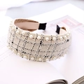 Detailed view of the cream tweed headband texture with white pearl accents and woven pattern - Pearl Beaded Wide Style / White Tweed Small Plaid With Pearl