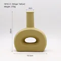 Abstract modern matte ginger yellow hollow ceramic vase with ring-shaped base - 16.5x20cm / Turmeric