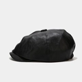 Close-up of black PU leather newsboy cap showing detailed eight-panel texture and short brim - M (56-58cm) / Black