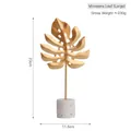 Large golden monstera leaf iron ornament with terrazzo base for modern home decor - Monstera Leaf-Large