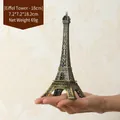 Bronze 18.2cm Eiffel Tower souvenir model with Paris engraving shown in palm - Bronze - 18CM Tower