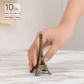 Vintage bronze Eiffel Tower metal ornament 10cm height held in hand for scale - Bronze - 10CM Tower