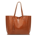 Minimalist brown oil wax leather bucket bag with tassel detail and dual shoulder straps - Brown
