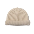 Detailed view of the soft ribbed texture and wide folded brim of the cream knit beanie - Beige