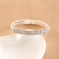 Elegant silver-colored double-row crystal stretch bracelet on white ceramic heart tray - 2-Layer Bracelet