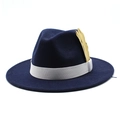 Detail of dark blue fedora hat with white ribbon band and golden feather pin accessory - Adjustable / Navy Blue